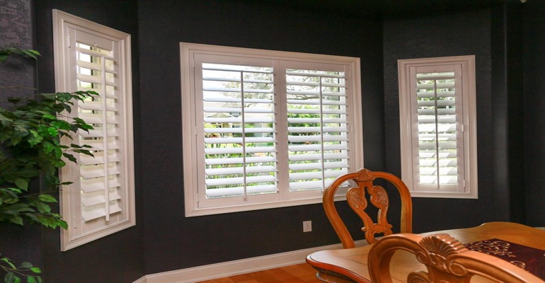White Plantation Shutters In Dining Room With Dark Paint
