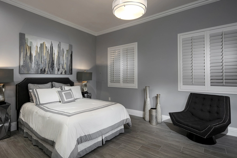 Close your custom Polywood shutters to beat the heat and keep your Philadelphia bedroom cool. White Polywood shutters on bedroom windows
