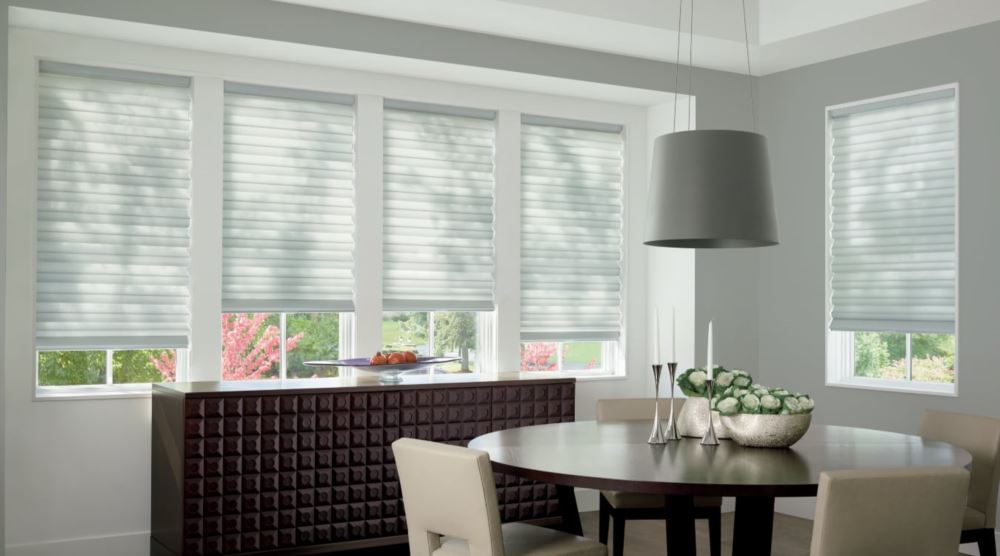 Custom cordless roller shades have a clean look and are appropriate for any room. Cordless motorized shades in a Philadelphia dining room
