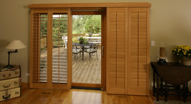 Theme your wood to create a transition from inside to outside. Philadelphia wood shutter sliding door