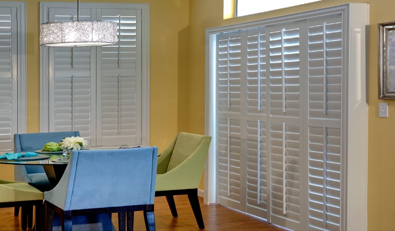 Plantation shutters on a French door function like common window shutters. Patio Doors with Plantation Shutters in Philadelphia