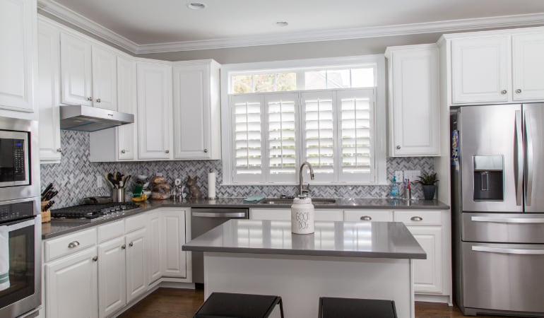 Polywood® plantation shutters resist heat and moisture in your kitchen. Polywood shutters in a Philadelphia gourmet kitchen.