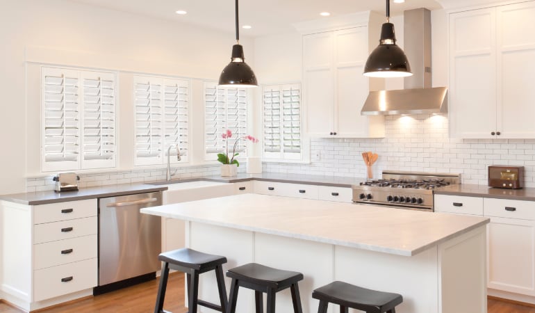 Plantation shutters let you control the amount of light in your kitchen. Plantation shutters in a bright Philadelphia kitchen.