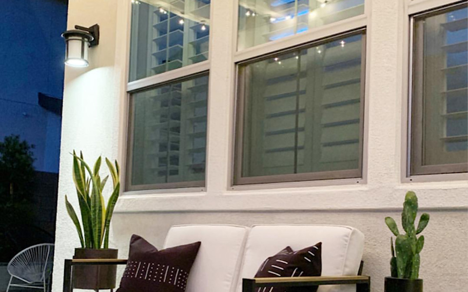 Fix up your patio to create an inviting outdoor living space. Photo credit: Audrey Crisp Interiors Outdoor patio area with white furnishings.