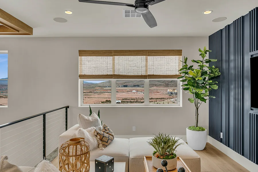 Philadelphia homeowners who want eco-friendly home fixtures should consider natural woven shades. Natural brown woven shades on a window in a stylish sitting area