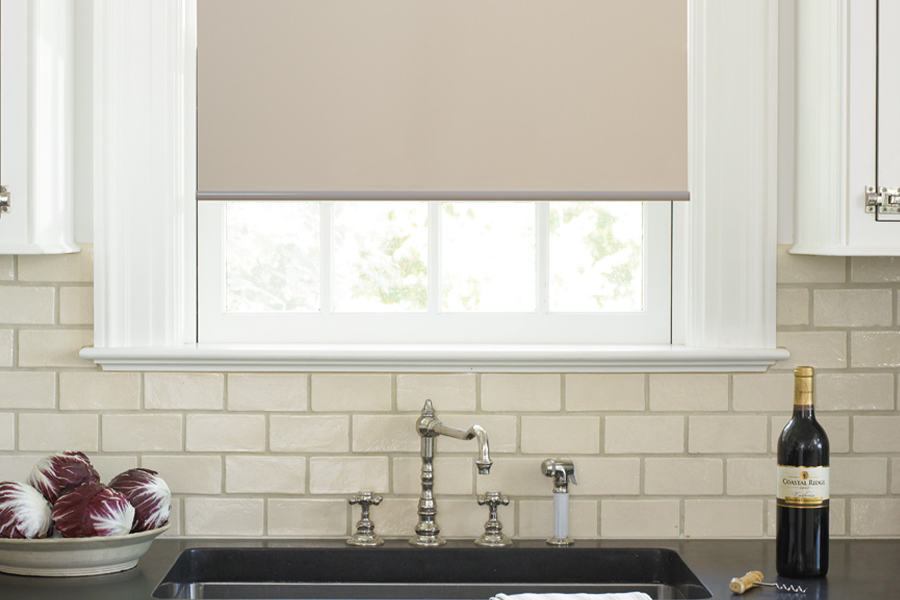 Roller shades opens up a lot of color and style options for your gourmet kitchen at Philadelphia. Roller shade above a kitchen sink.