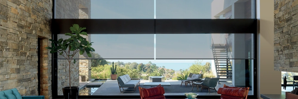 Window shades covering a large floor-to-ceiling window