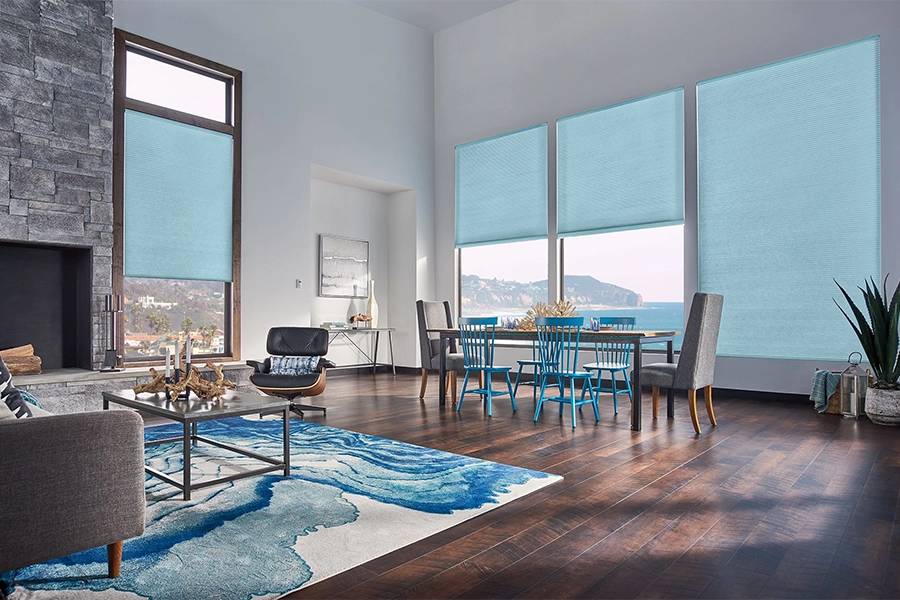 Smart motorized window shades are perfect on tall windows in your Philadelphia home. Blue motorized shades on tall living room windows