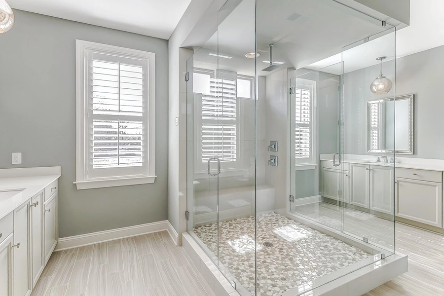 White Polywood shutters on twin bathroom windows