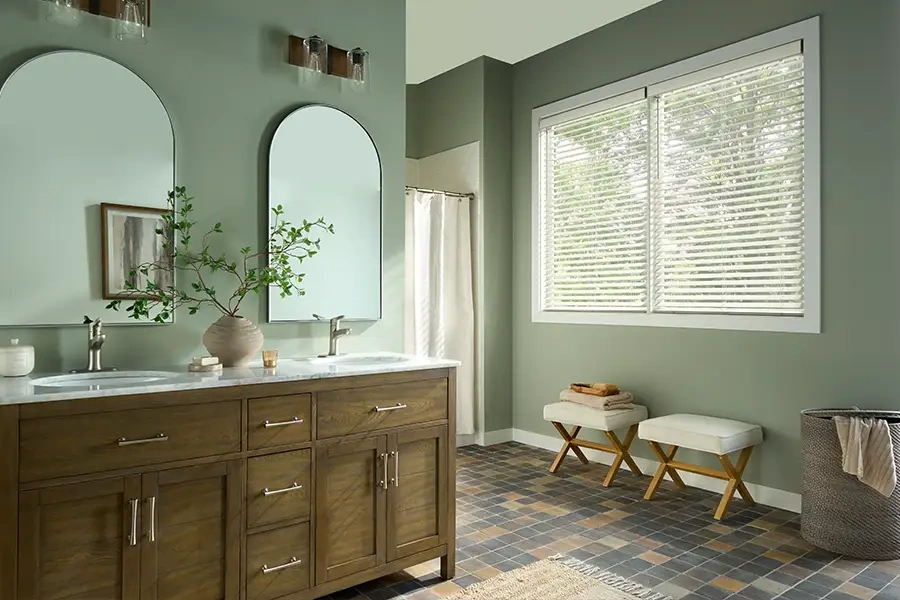 white wooden blinds in a smal bathroom area